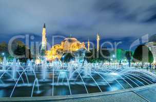 Sultanahmet fountain at night with Blue Mosque on background