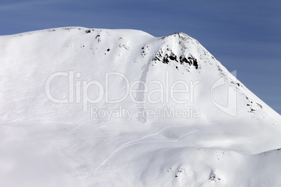Off-piste slope with traces from avalanches