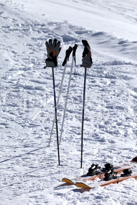 Skiing equipment on ski slope at sun day