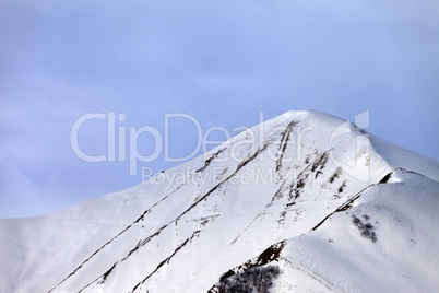 Off-piste snowy slope in morning