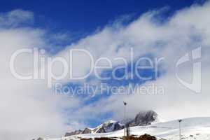 Ski slope and blue sky with clouds