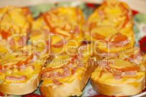 hot sandwiches with sausage and melted cheese