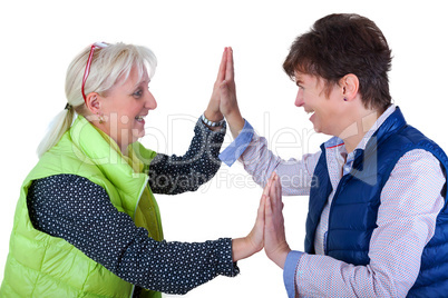 Two middle-aged girlfriends clapping away