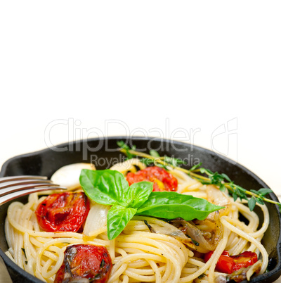 spaghetti pasta with baked cherry tomatoes and basil