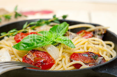 spaghetti pasta with baked cherry tomatoes and basil
