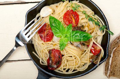 spaghetti pasta with baked cherry tomatoes and basil