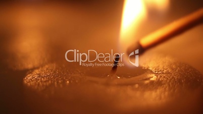 lighting candle by matchstick close-up