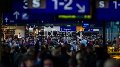 crowed people walking in illuminated central station timelapse