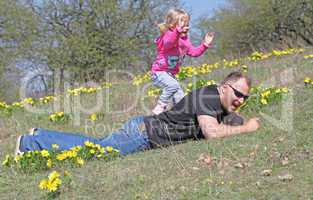 Father and daughter playing in the park