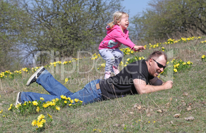 Father and daughter playing in the park