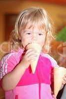 Portrait of young girl eating ice-cream