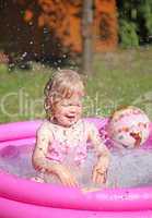 Portrait of little girl enjoying her vacation in the pool outdoors