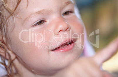 Portrait of a happy little girl close-up