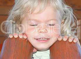 Portrait of a happy little girl close-up