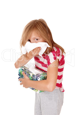 Girl blowing her nose.