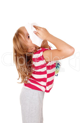Girl with tissue on her nose.