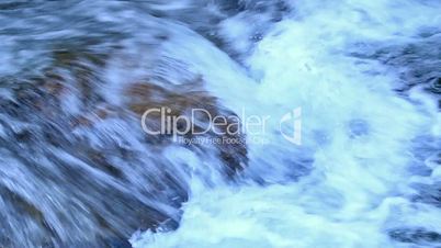 Beautiful veil cascading waterfall, mossy rocks