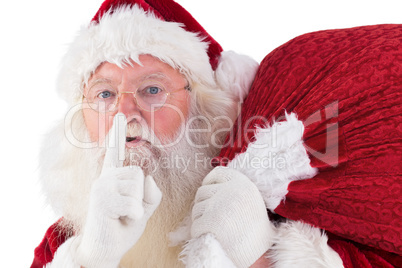 Santa asking for quiet with bag