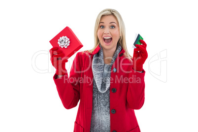 Festive blonde holding gift and credit card