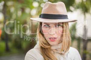 Cheerful blonde with hat posing