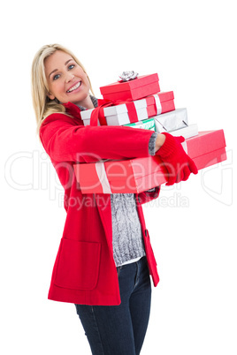 Festive blonde holding many gifts