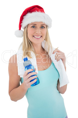 Festive fit blonde smiling at camera