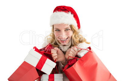 Girl in winter fashion holding presents and shopping bags