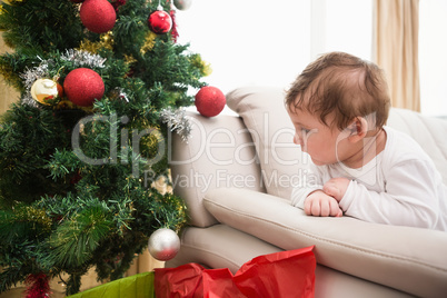 Cute baby boy on couch at christmas