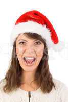 Young woman in santa hat yelling