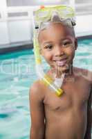 Cute little boy wearing snorkel and goggles