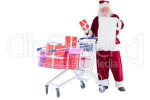 Santa spread presents with shopping cart