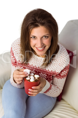 Woman enjoy her coffee sitting on the sofa