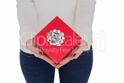 Woman with nail varnish holding red gift
