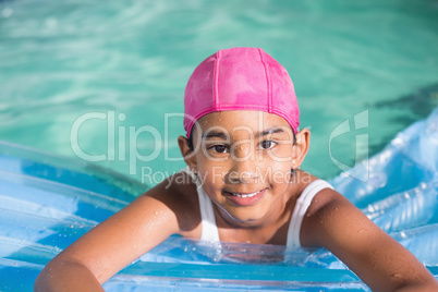 Cute little girls swimming in the pool