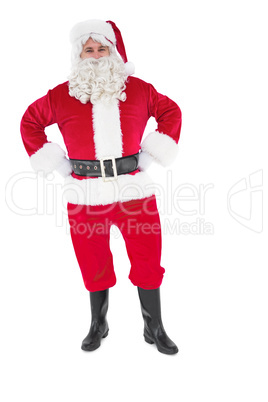 Portrait of santa claus with hands on hips
