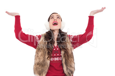 Brunette in winter clothes with hands out