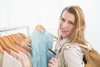 Pretty shopping blonde smiling at the camera Pretty shopping blonde smiling at the camera
