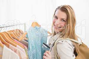 Pretty shopping blonde smiling at the camera