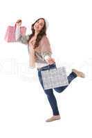 Pretty brunette posing with shopping bags