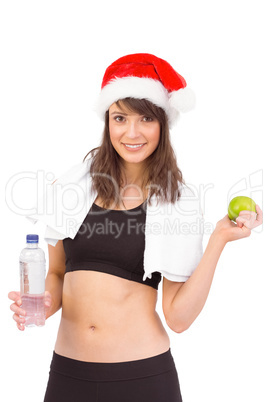 Festive fit brunette smiling at camera