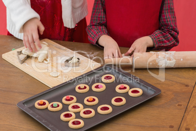 Festive little girls making christmas cookies