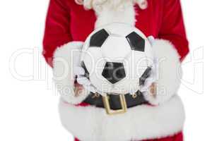 Mid section of santa holding football