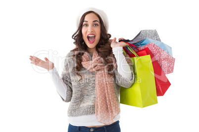 Excited brunette with shopping bags