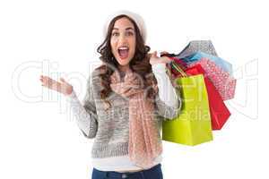 Excited brunette with shopping bags