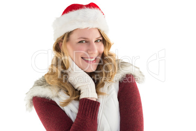 Festive blonde smiling in santa hat