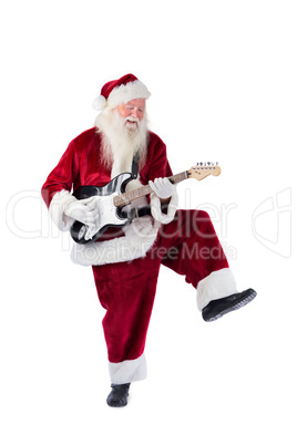 Santa Claus has fun with a guitar