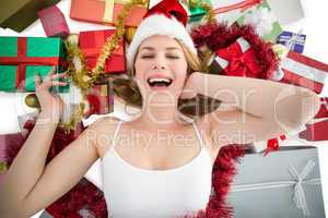 Smiling woman laying on the floor with gifts and garland