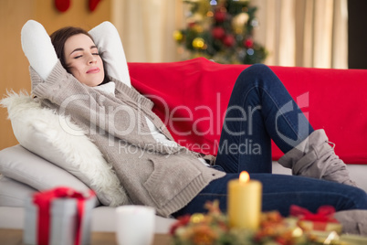 Brunette napping on the couch at christmas