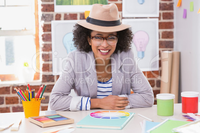 Portrait of female interior designer at desk