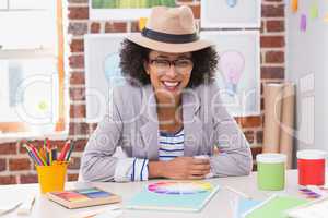 Portrait of female interior designer at desk